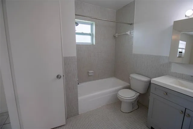 a bathroom with a toilet and a bathtub
