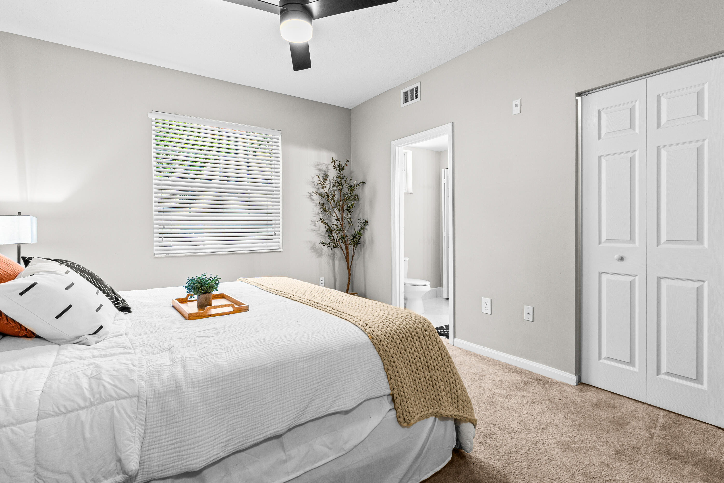 1959 Brandywine Road, Unit 208 West Palm Beach, FL 33409 - Photo 14 of 36 a bedroom with a bed and a window