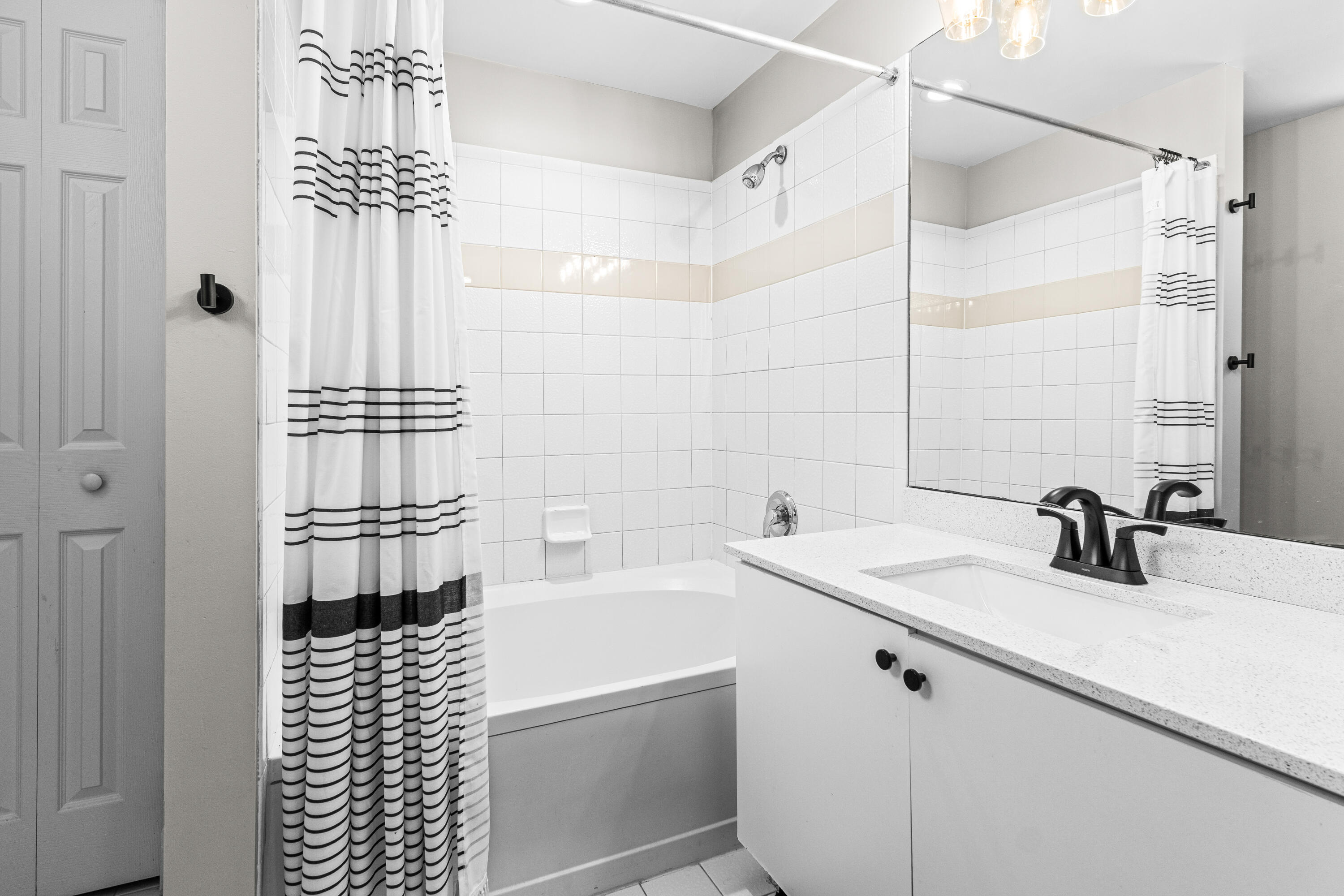 1959 Brandywine Road, Unit 208 West Palm Beach, FL 33409 - Photo 16 of 36 a bathroom with a sink a toilet and shower