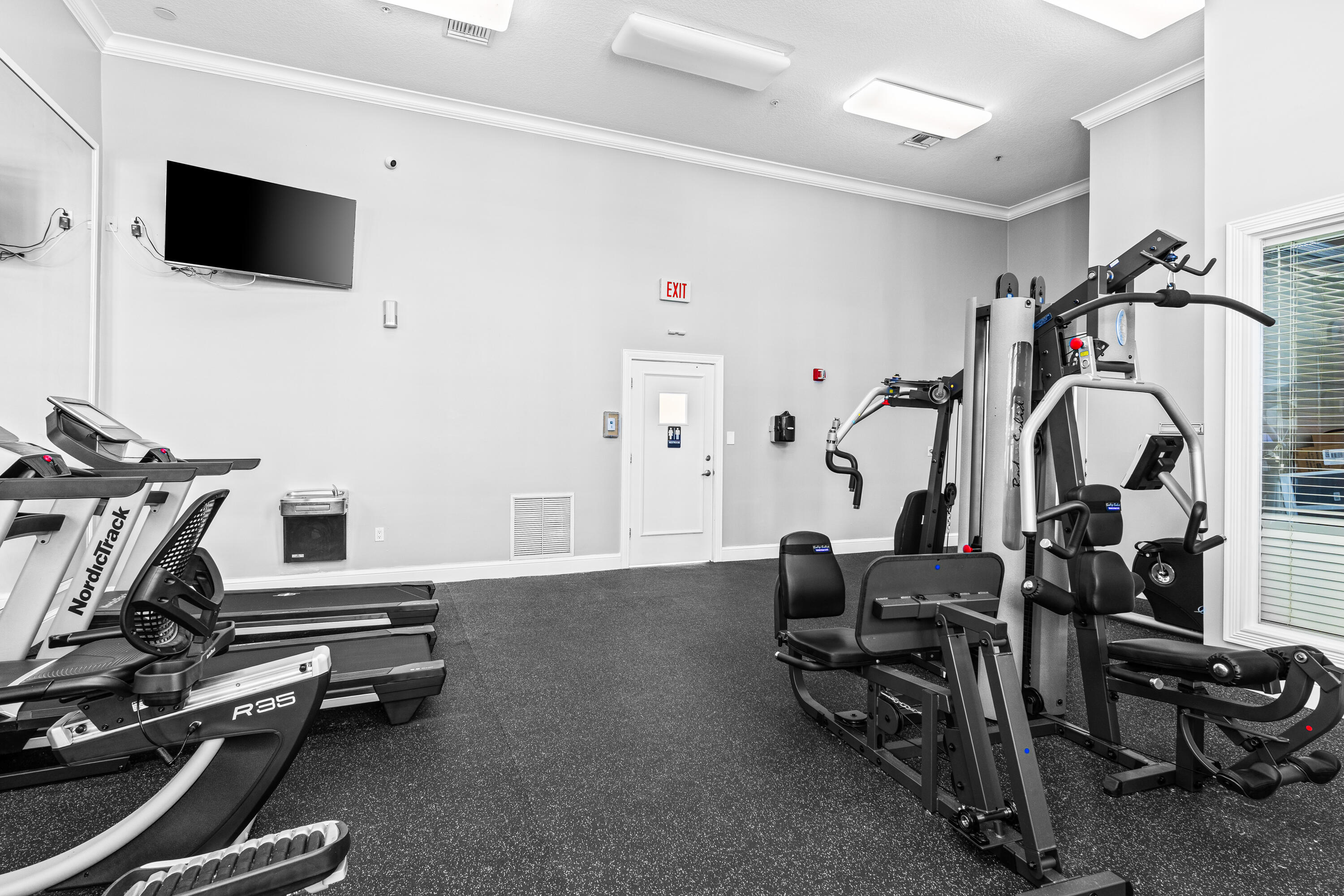 1959 Brandywine Road, Unit 208 West Palm Beach, FL 33409 - Photo 18 of 36 a view of a room with gym equipment