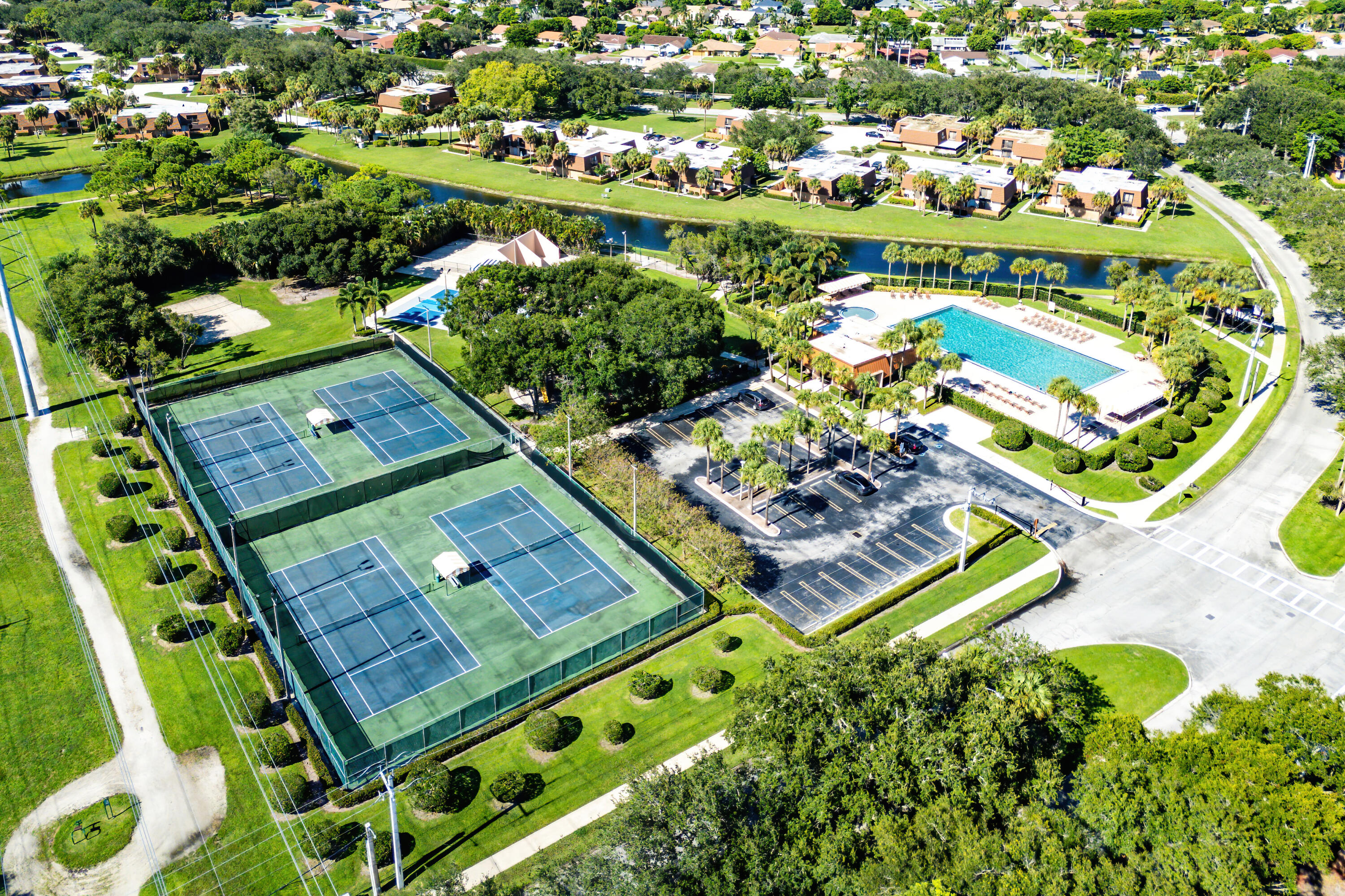 1959 Brandywine Road, Unit 208 West Palm Beach, FL 33409 - Photo 27 of 36 an aerial view of a pool yard and outdoor seating