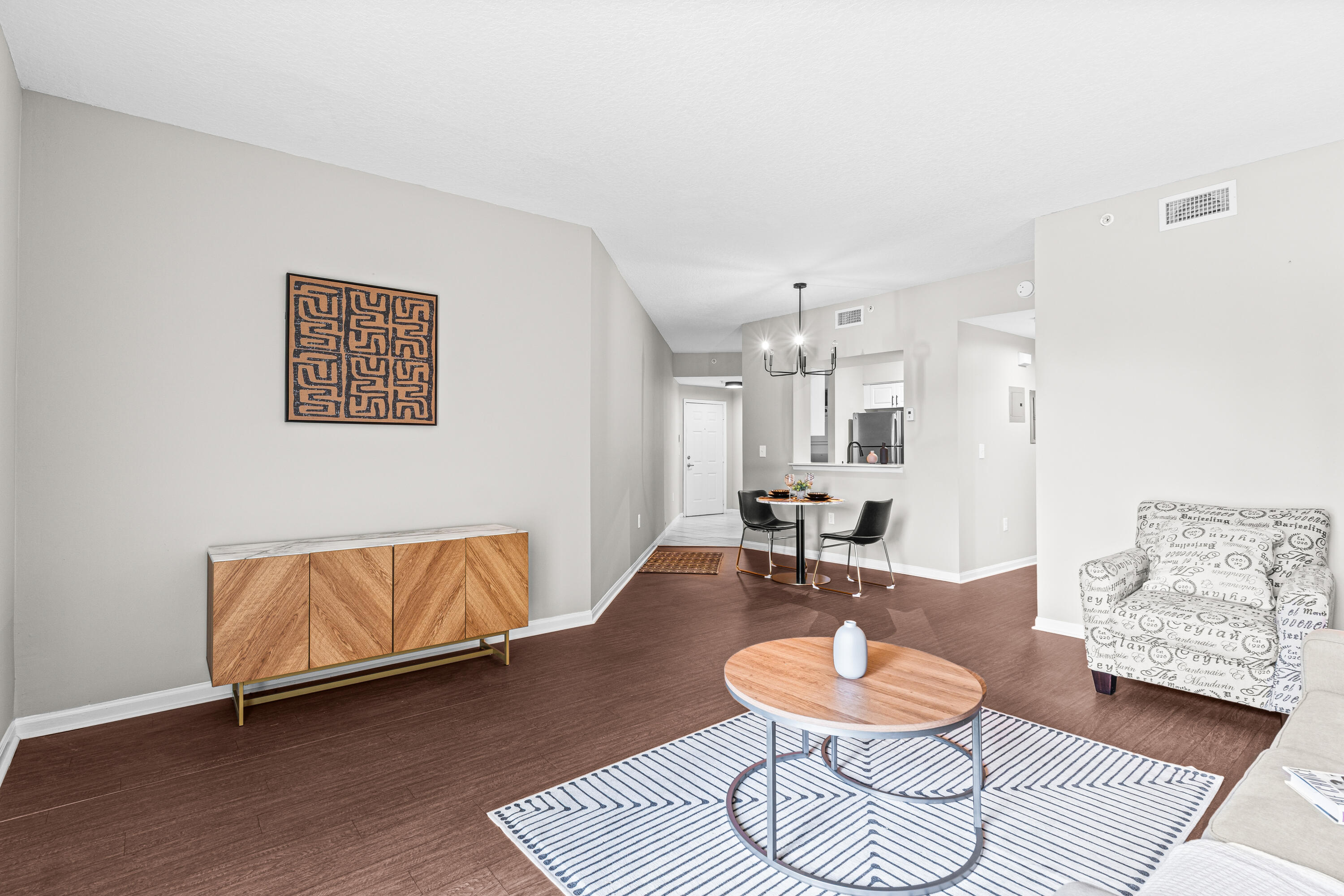 1959 Brandywine Road, Unit 208 West Palm Beach, FL 33409 - Photo 4 of 36 a living room with furniture and a wooden floor