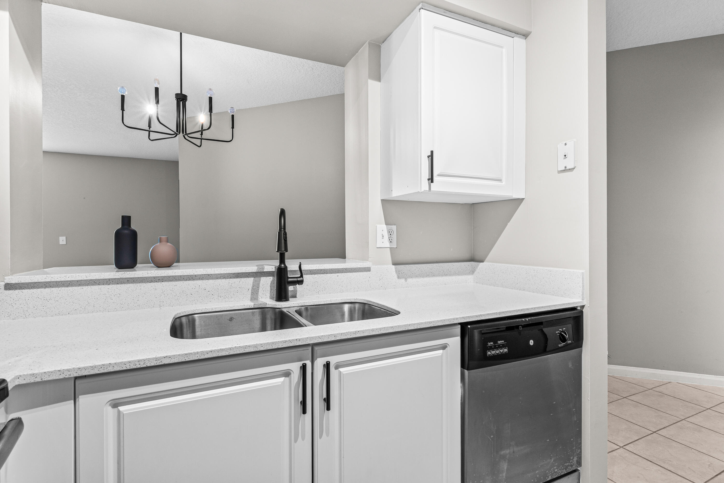 1959 Brandywine Road, Unit 208 West Palm Beach, FL 33409 - Photo 7 of 36 a kitchen with a sink and cabinets