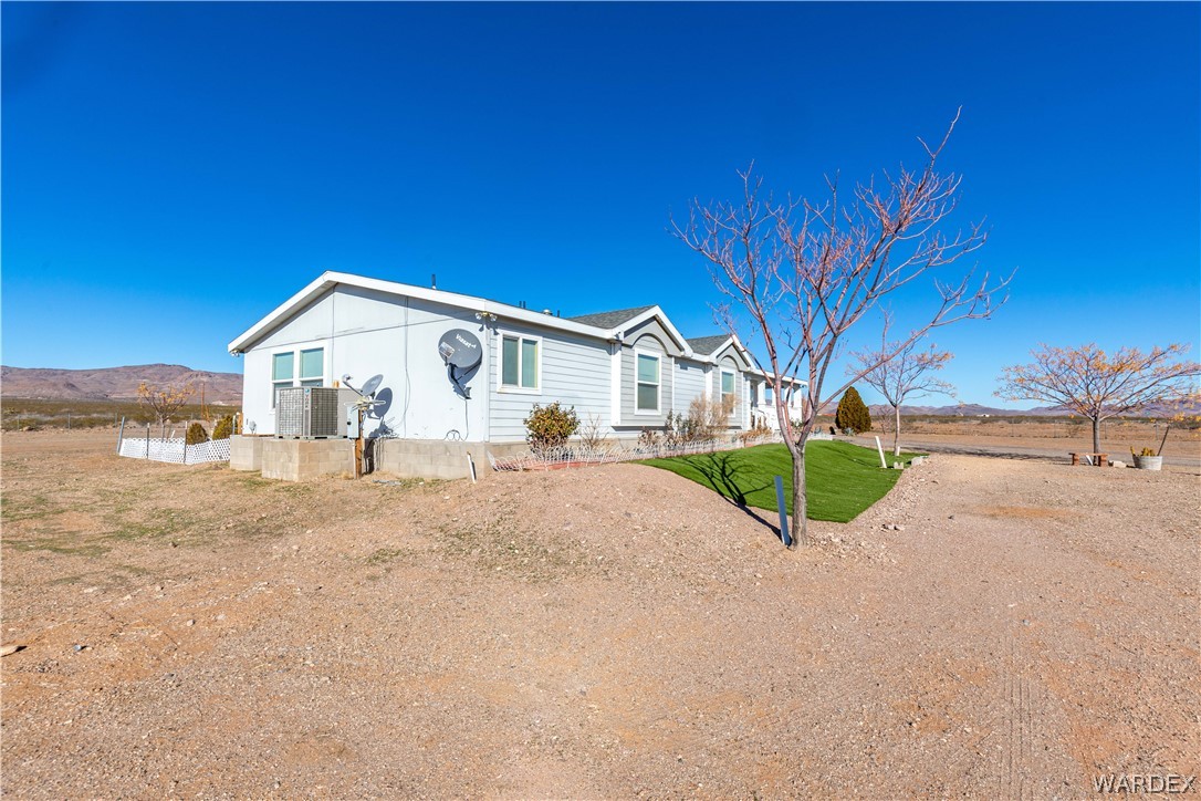 4217 Dilkon Road Golden Valley, AZ 86413 - Photo 54 of 57 a view of a house with a road