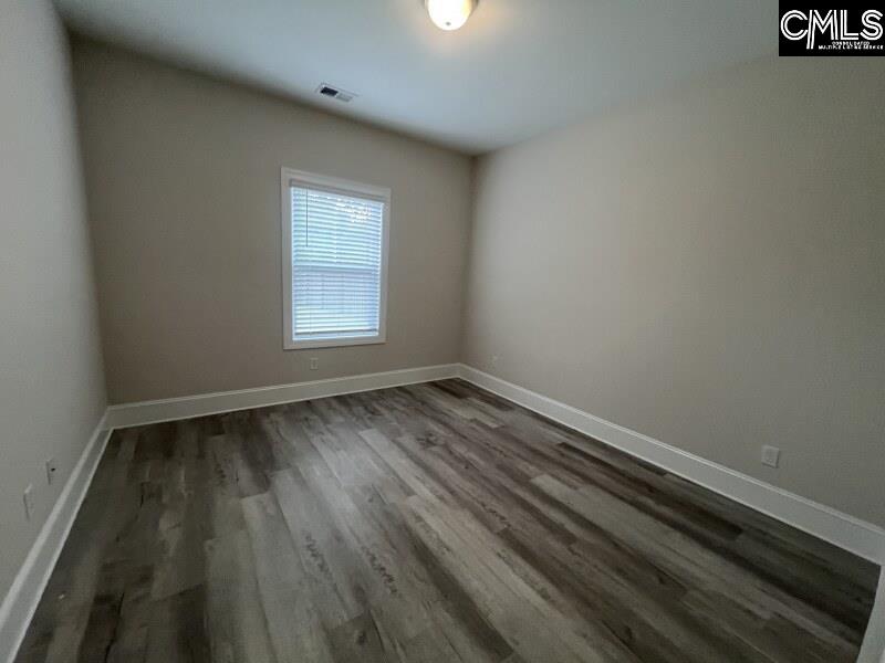 516 Mitscher Way Chapin, SC 29036 - Photo 16 of 18 a view of a room with wooden floor and window