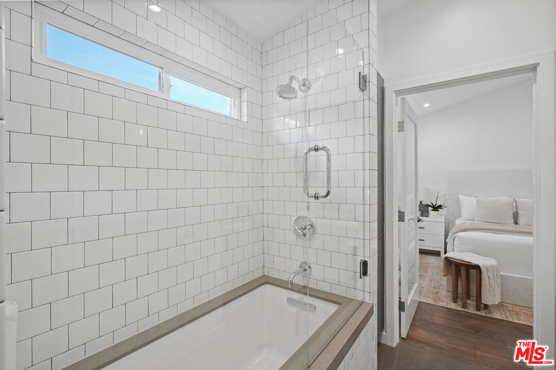940 Rose Avenue Venice, CA 90291 - Photo 26 of 39 a bathroom with a bathtub and a shower
