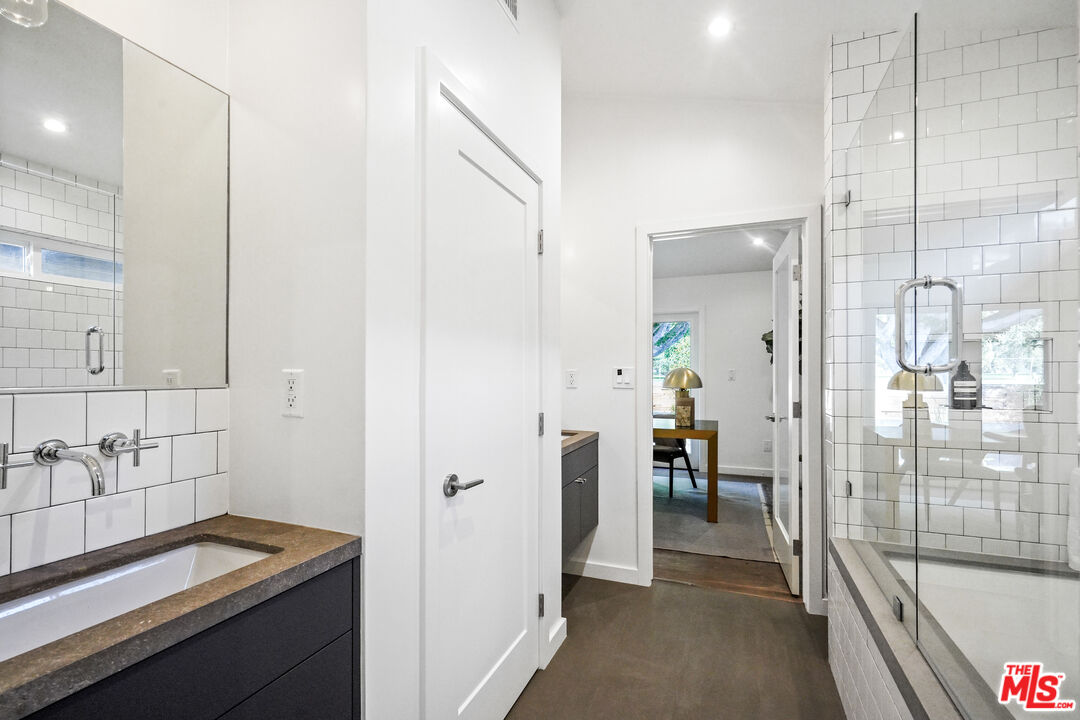 940 Rose Avenue Venice, CA 90291 - Photo 28 of 39 a bathroom with a sink and a shower