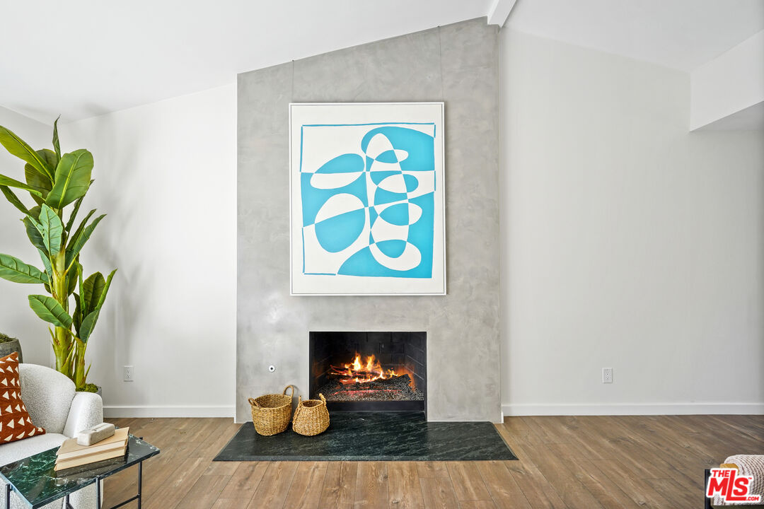 940 Rose Avenue Venice, CA 90291 - Photo 5 of 39 a living room with furniture and a fireplace