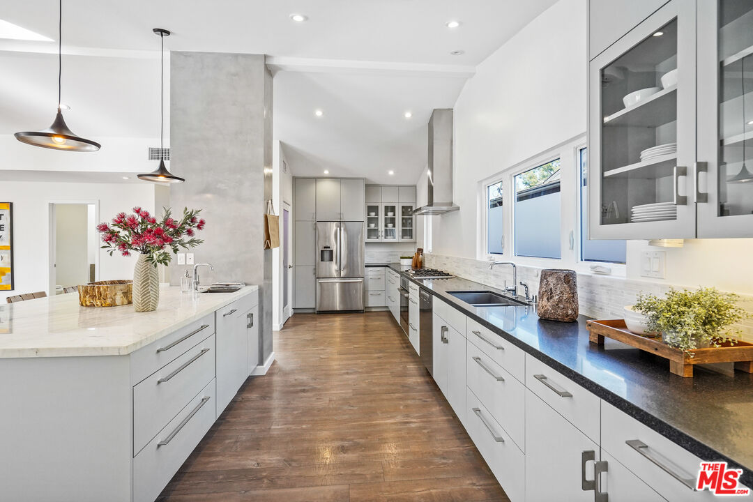 940 Rose Avenue Venice, CA 90291 - Photo 7 of 39 a large white kitchen with lots of counter top space