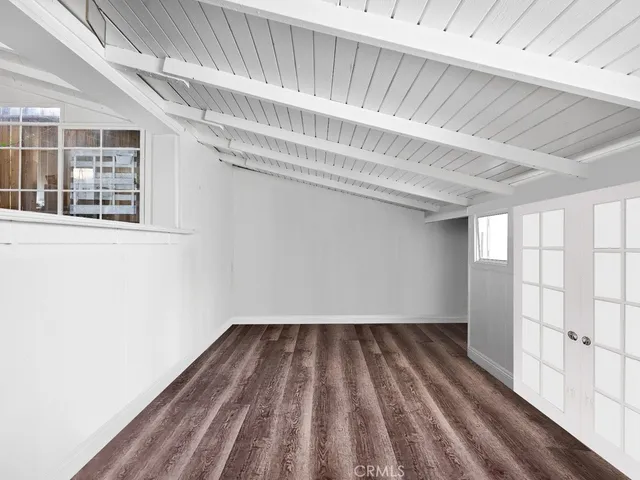 a view of a room with wooden floor and staircase