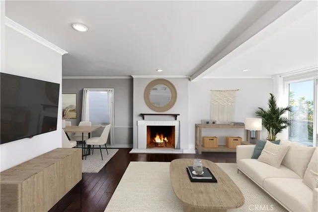 a living room with furniture fireplace and window