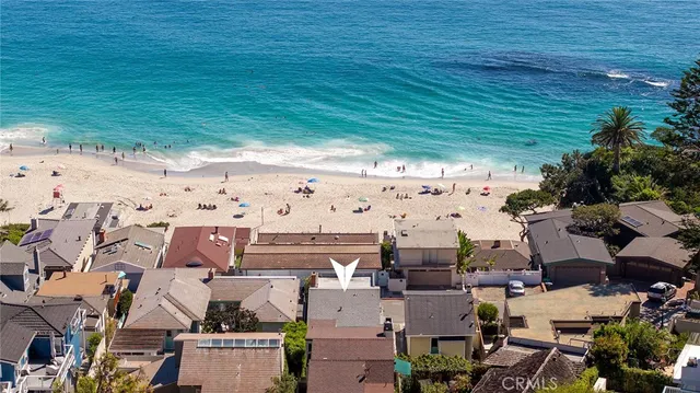 a view of a dry yard with wooden fence