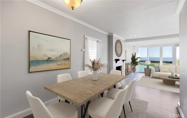 a view of a dining room with furniture and a large window