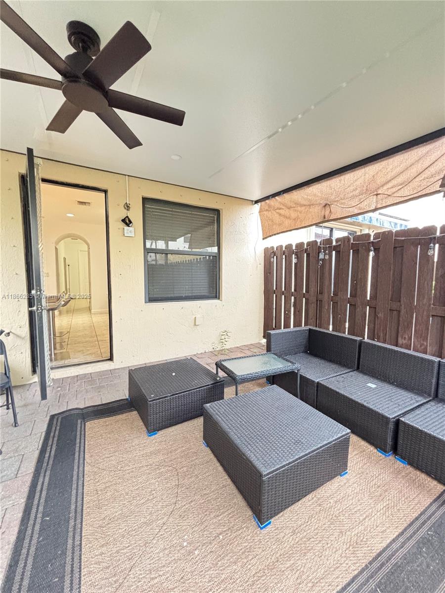 17443 Southwest 153rd Path, Unit 17443 Miami, FL 33187 - Photo 10 of 10 a living room with furniture and a large window