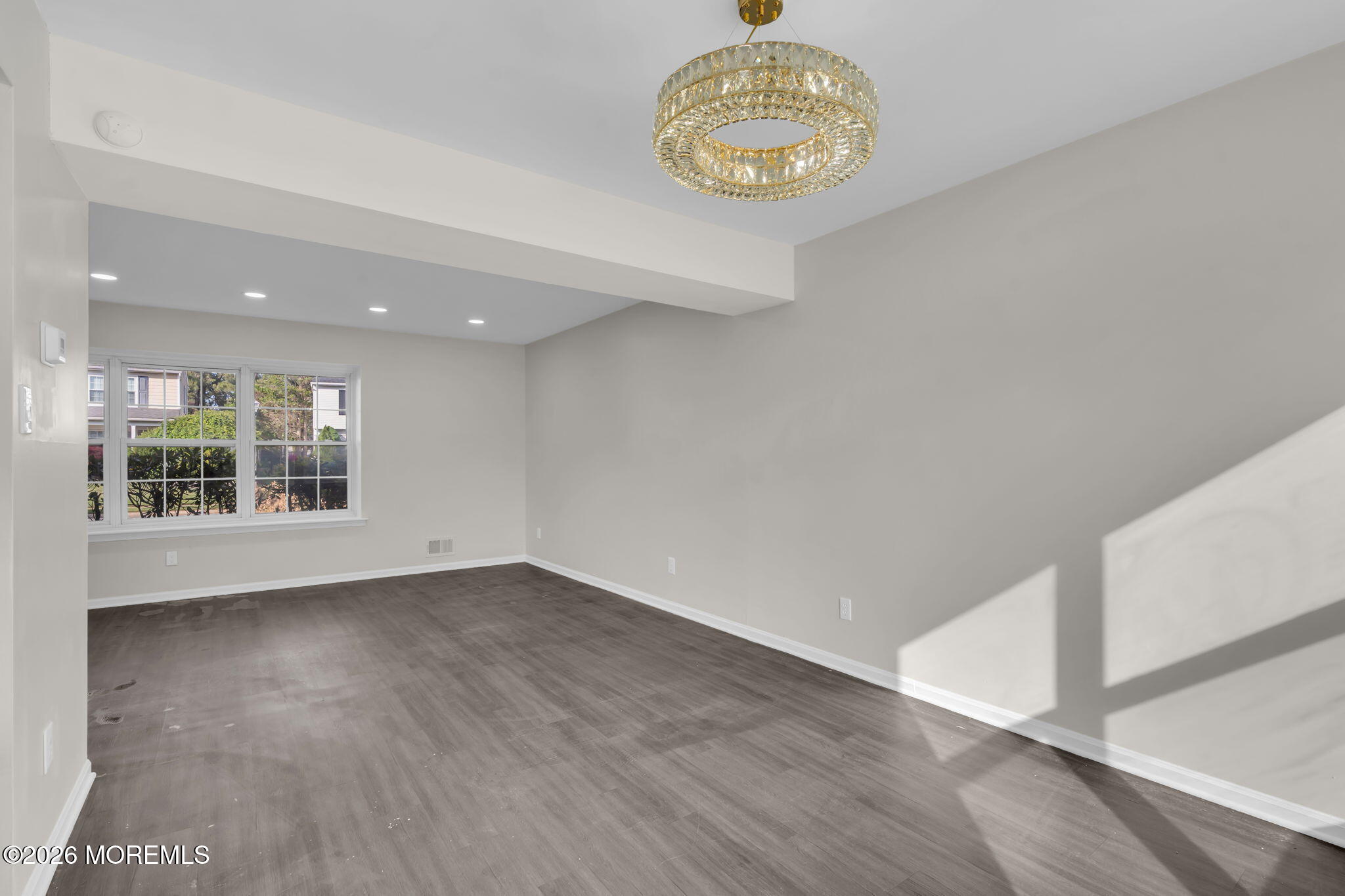 45 Peachstone Road Howell, NJ 07731 - Photo 16 of 54 an empty room with wooden floor and a window