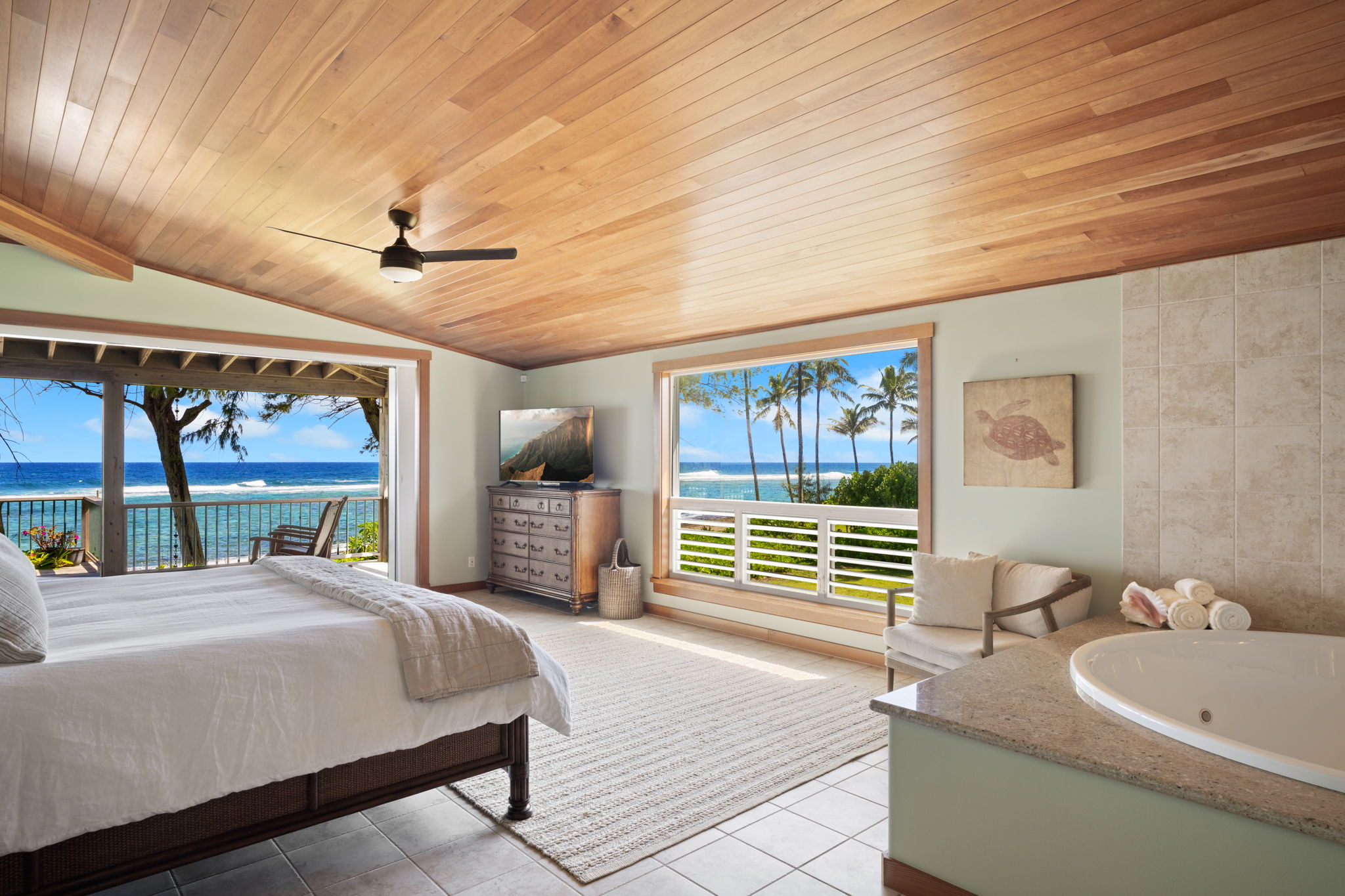 7312 Alealea Road Hanalei, HI 96714 - Photo 12 of 30 a bed room with a bed and a large window