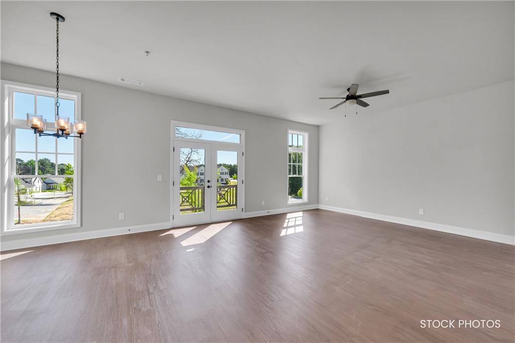1038 Homestead Way Street Dacula, GA 30019 - Photo 5 of 36 a view of room window and wooden floor