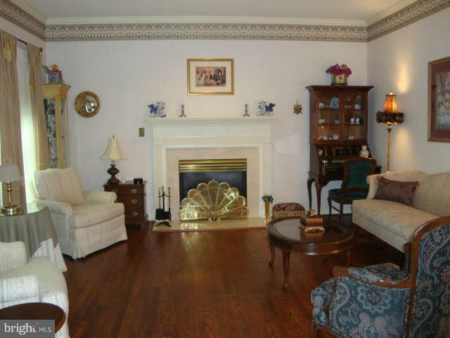 2470 Five Shillings Road Frederick, MD 21701 - Photo 2 of 17 a living room with furniture and a fireplace
