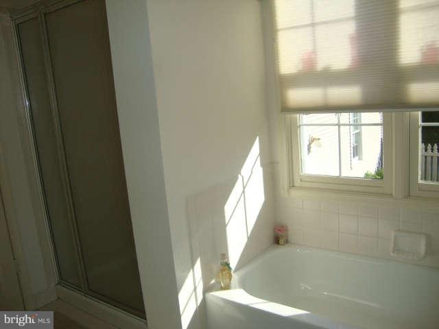 2470 Five Shillings Road Frederick, MD 21701 - Photo 13 of 17 a view of a bathroom with a bathtub