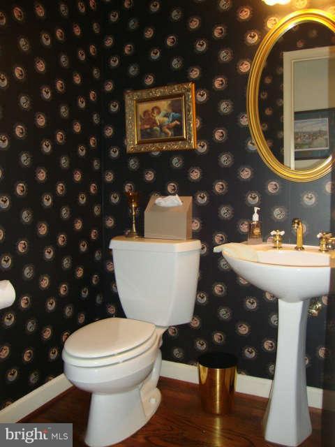 2470 Five Shillings Road Frederick, MD 21701 - Photo 14 of 17 a bathroom with a toilet a sink and a mirror