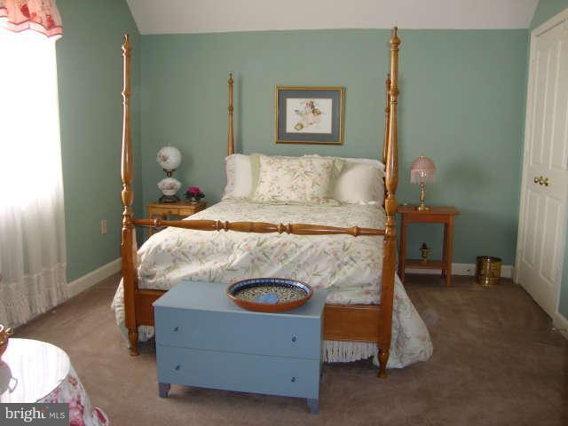 2470 Five Shillings Road Frederick, MD 21701 - Photo 16 of 17 a bed sitting in a bedroom next to a window