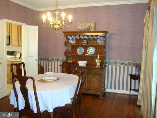 2470 Five Shillings Road Frederick, MD 21701 - Photo 3 of 17 a view of a dining room with furniture and chandelier