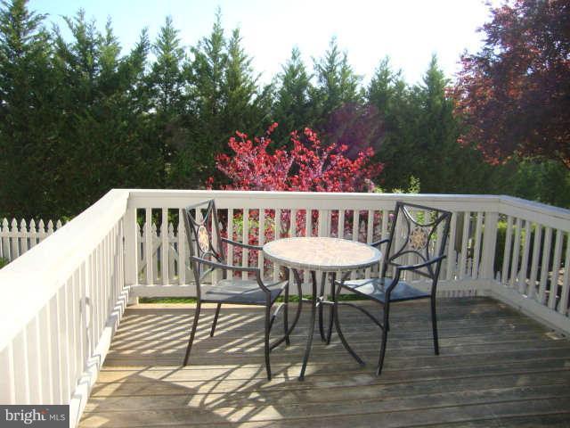2470 Five Shillings Road Frederick, MD 21701 - Photo 7 of 17 a view of a chairs and table on the deck