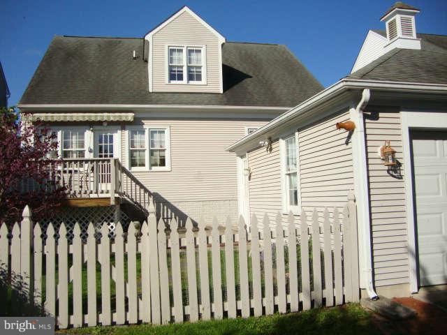 2470 Five Shillings Road Frederick, MD 21701 - Photo 9 of 17 a front view of a house with wooden fence