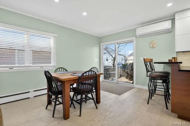 a view of a dining room with furniture window and outside view