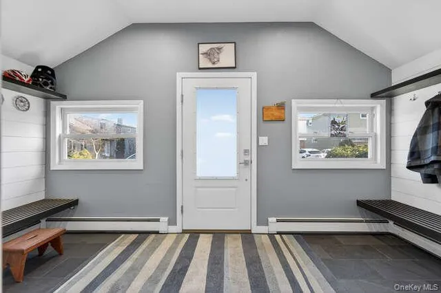 a view of room with window and wooden floor