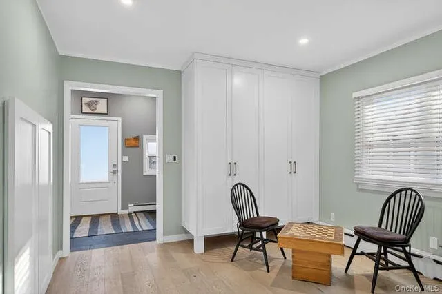a view of a livingroom with workspace and a couch