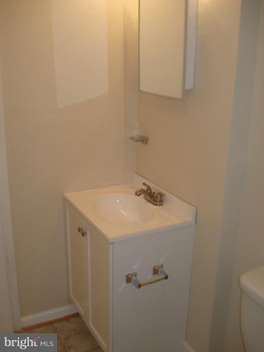 1975 Addison Road South, Unit 1975 District Heights, MD 20747 - Photo 8 of 15 a bathroom with a sink and vanity