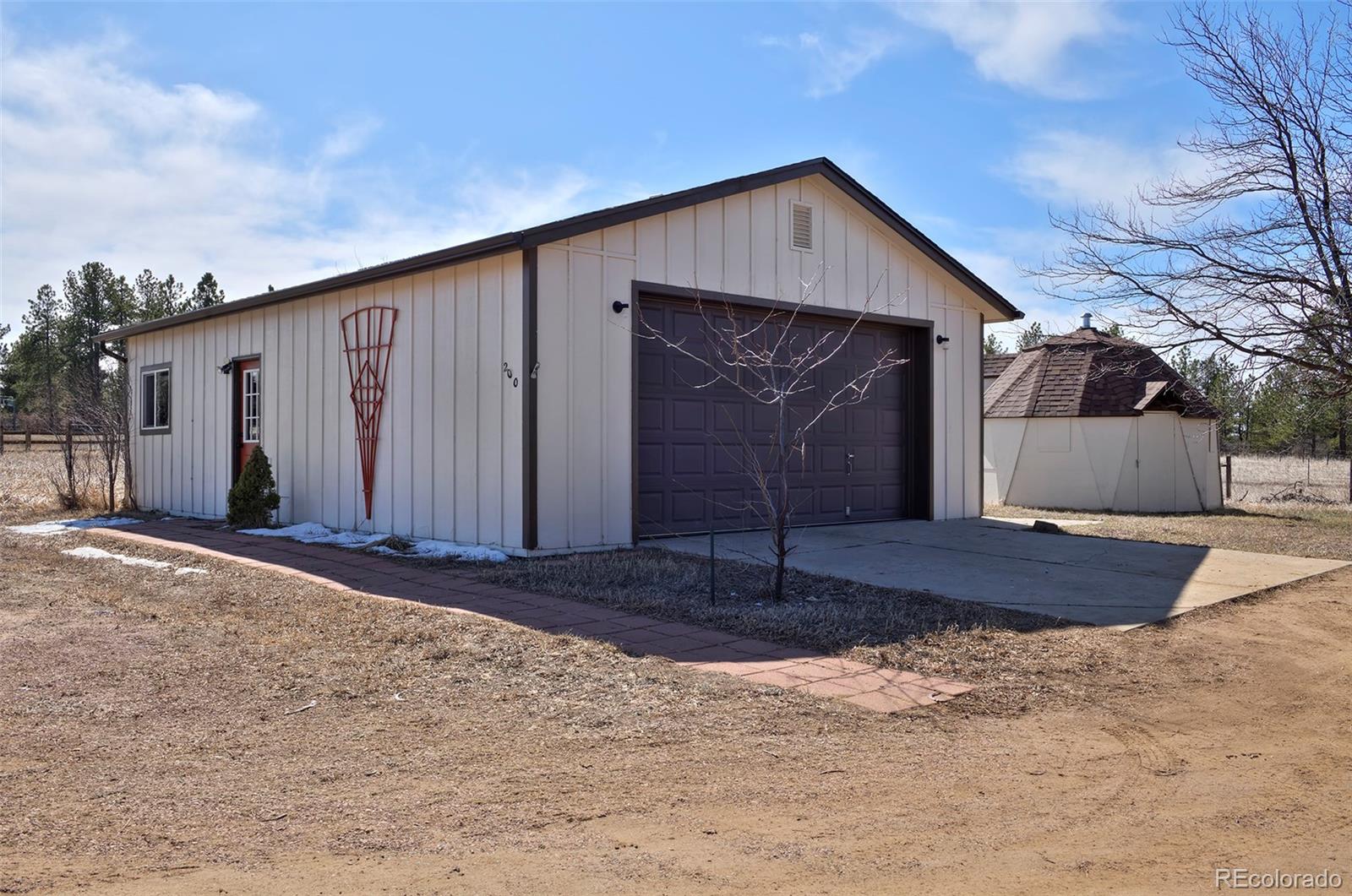 1340 Deerpath Trail Franktown, CO 80116 - Photo 35 of 44 a front view of house with yard