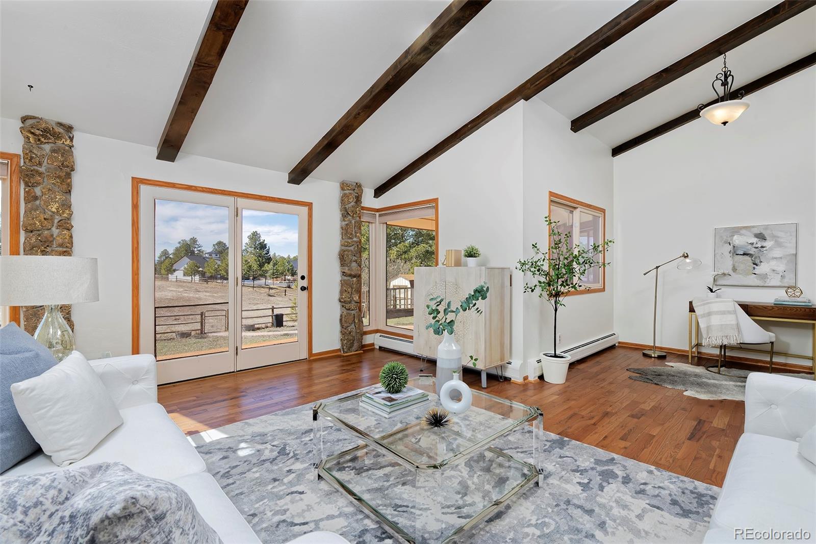 1340 Deerpath Trail Franktown, CO 80116 - Photo 4 of 44 a living room with furniture and a large window