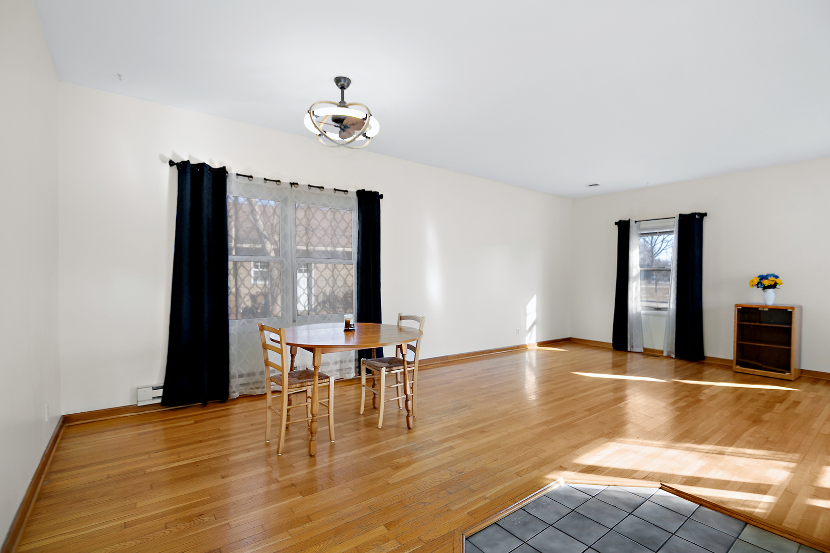 123 Crescent Lane Cabery, IL 60919 - Photo 4 of 22 a view of a dining room with furniture and wooden floor