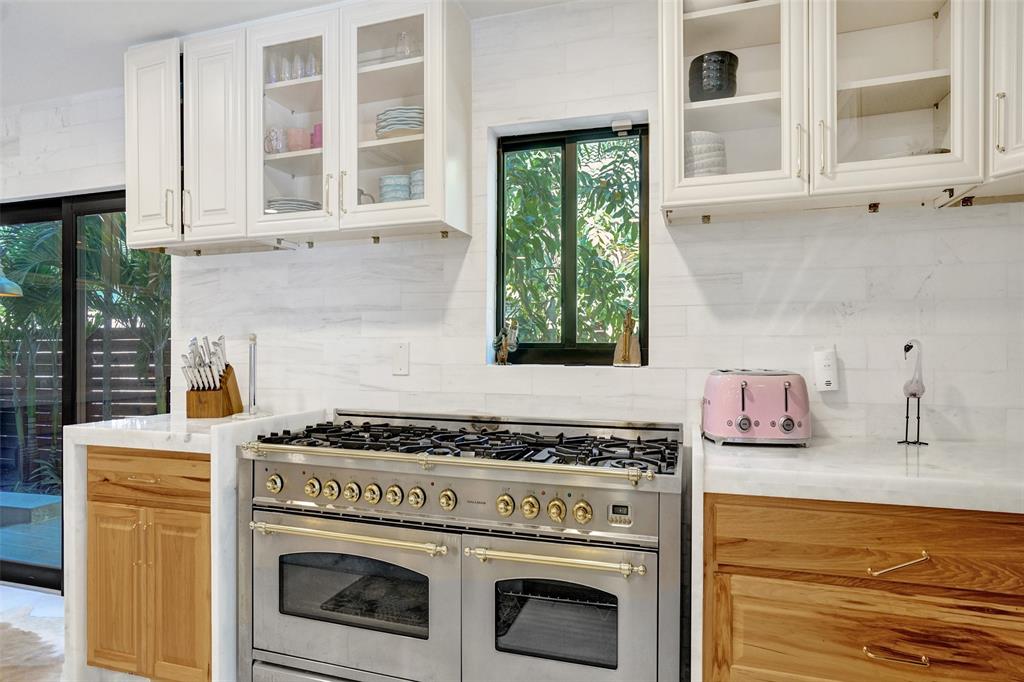 313 Layne Boulevard Hallandale Beach, FL 33009 - Photo 11 of 48 a kitchen with a stove and a sink