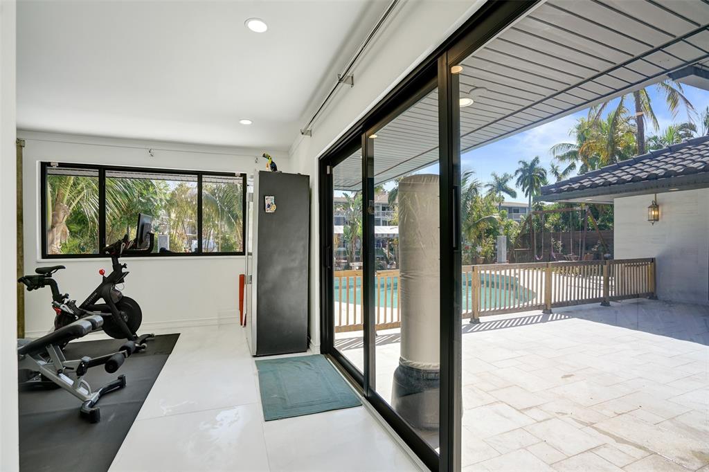 313 Layne Boulevard Hallandale Beach, FL 33009 - Photo 18 of 48 a room with furniture and a large window