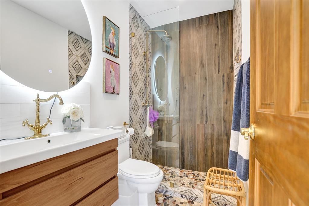 313 Layne Boulevard Hallandale Beach, FL 33009 - Photo 20 of 48 a bathroom with a sink a toilet and shower curtain