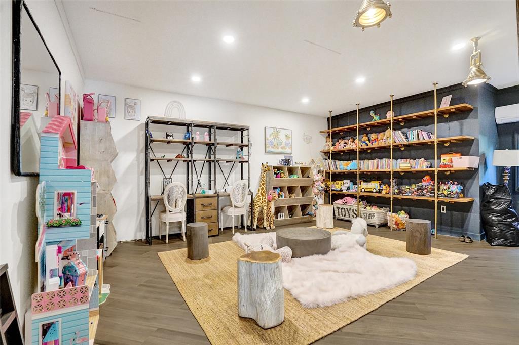 313 Layne Boulevard Hallandale Beach, FL 33009 - Photo 22 of 48 a living room with lots of furniture and book shelf