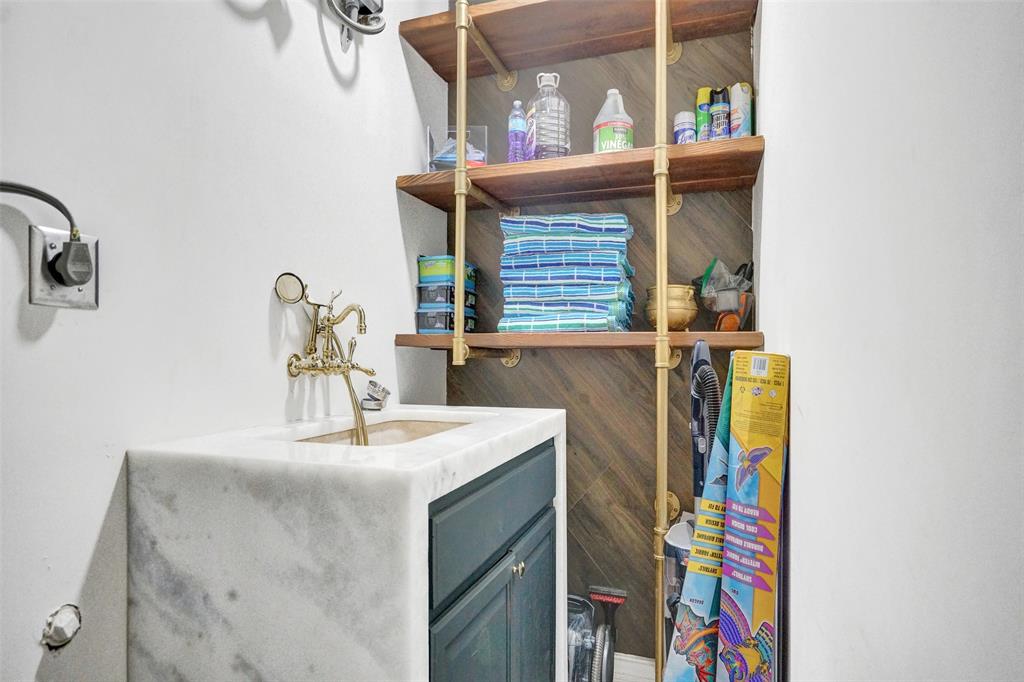 313 Layne Boulevard Hallandale Beach, FL 33009 - Photo 25 of 48 a bathroom with a sink and a mirror
