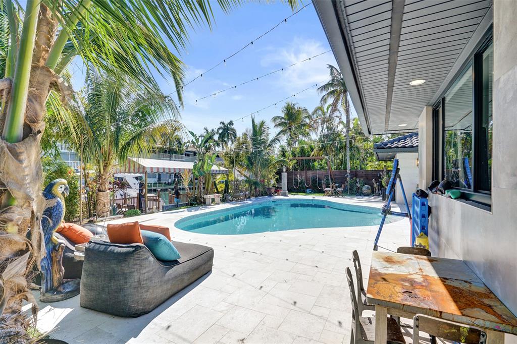 313 Layne Boulevard Hallandale Beach, FL 33009 - Photo 44 of 48 a view of a backyard with swimming pool