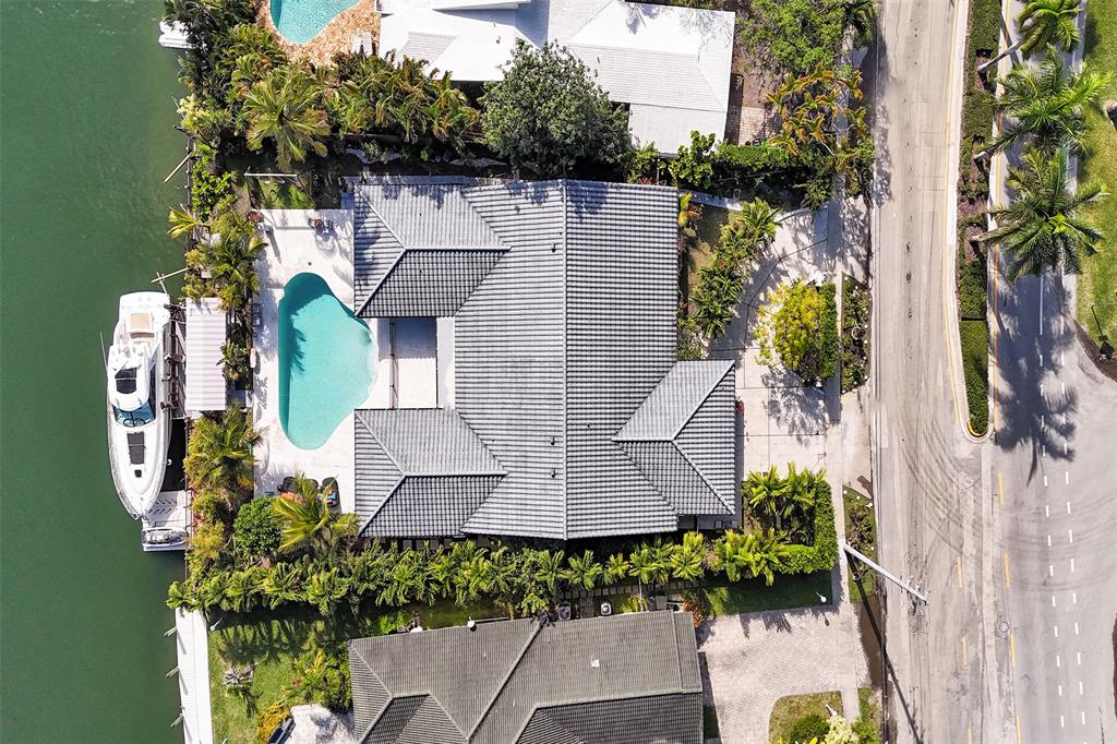 313 Layne Boulevard Hallandale Beach, FL 33009 - Photo 46 of 48 an aerial view of a house with garden space and street view