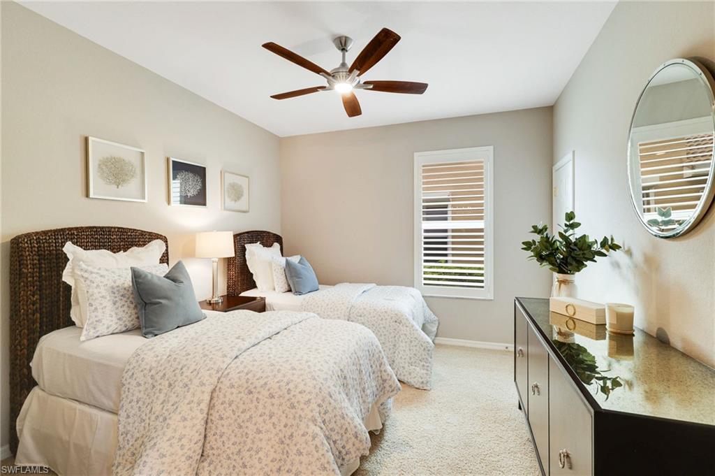 17897 Modena Road Miromar Lakes, FL 33913 - Photo 14 of 40 a bedroom with bed and a window