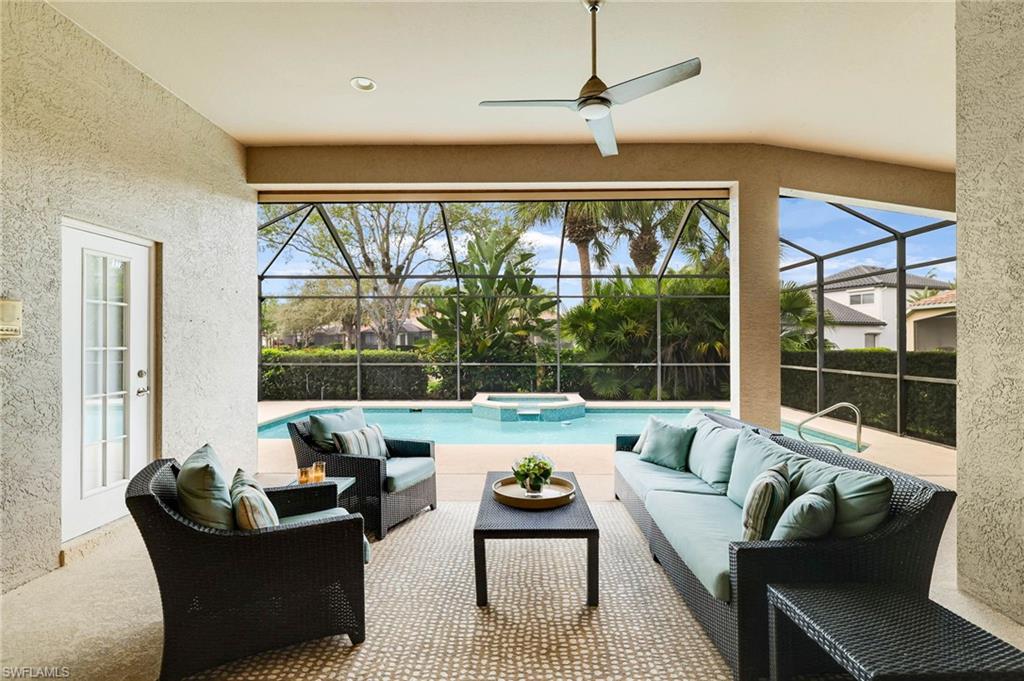 17897 Modena Road Miromar Lakes, FL 33913 - Photo 17 of 40 a living room with furniture and a large window
