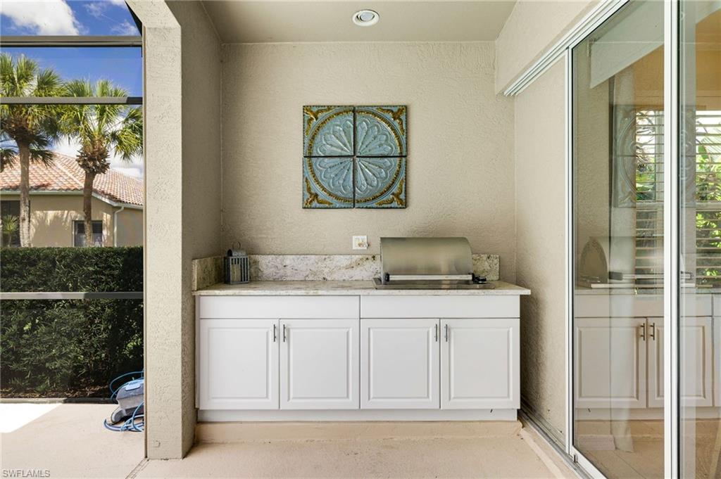 17897 Modena Road Miromar Lakes, FL 33913 - Photo 19 of 40 a bathroom with a sink and a mirror