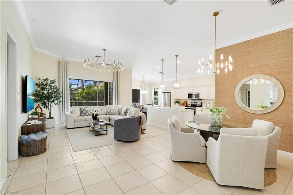17897 Modena Road Miromar Lakes, FL 33913 - Photo 2 of 40 a living room with furniture a window and a dining table