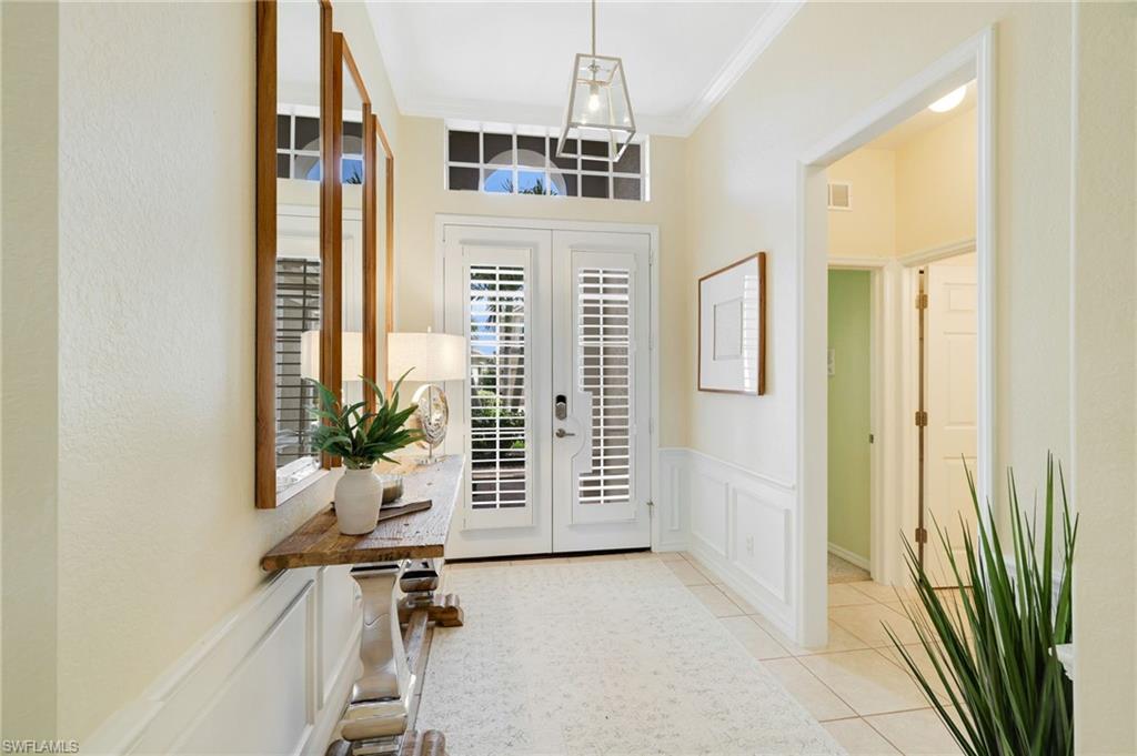 17897 Modena Road Miromar Lakes, FL 33913 - Photo 22 of 40 wooden floor and windows in a room