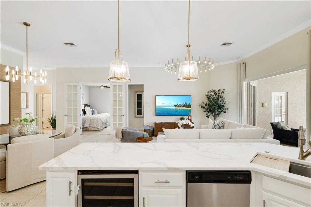 17897 Modena Road Miromar Lakes, FL 33913 - Photo 8 of 40 a view of living room kitchen and kitchen