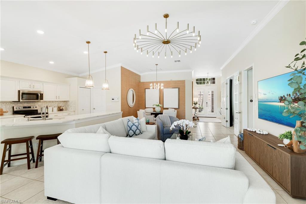 17897 Modena Road Miromar Lakes, FL 33913 - Photo 10 of 40 a living room with furniture and a large window