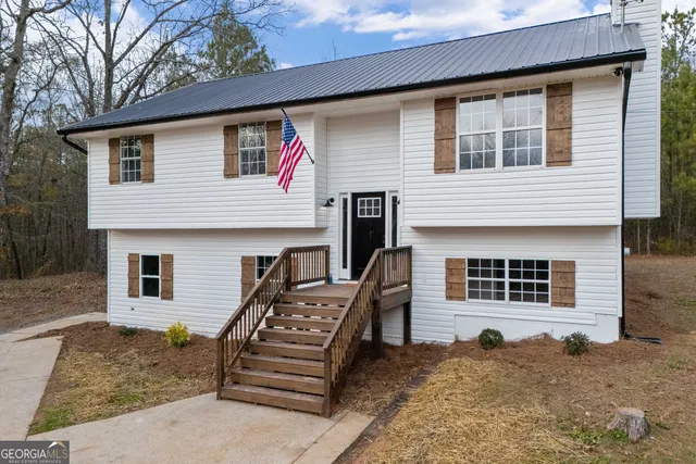 a front view of a house with stairs